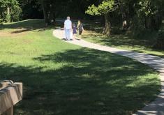 Woman and Child walking in park